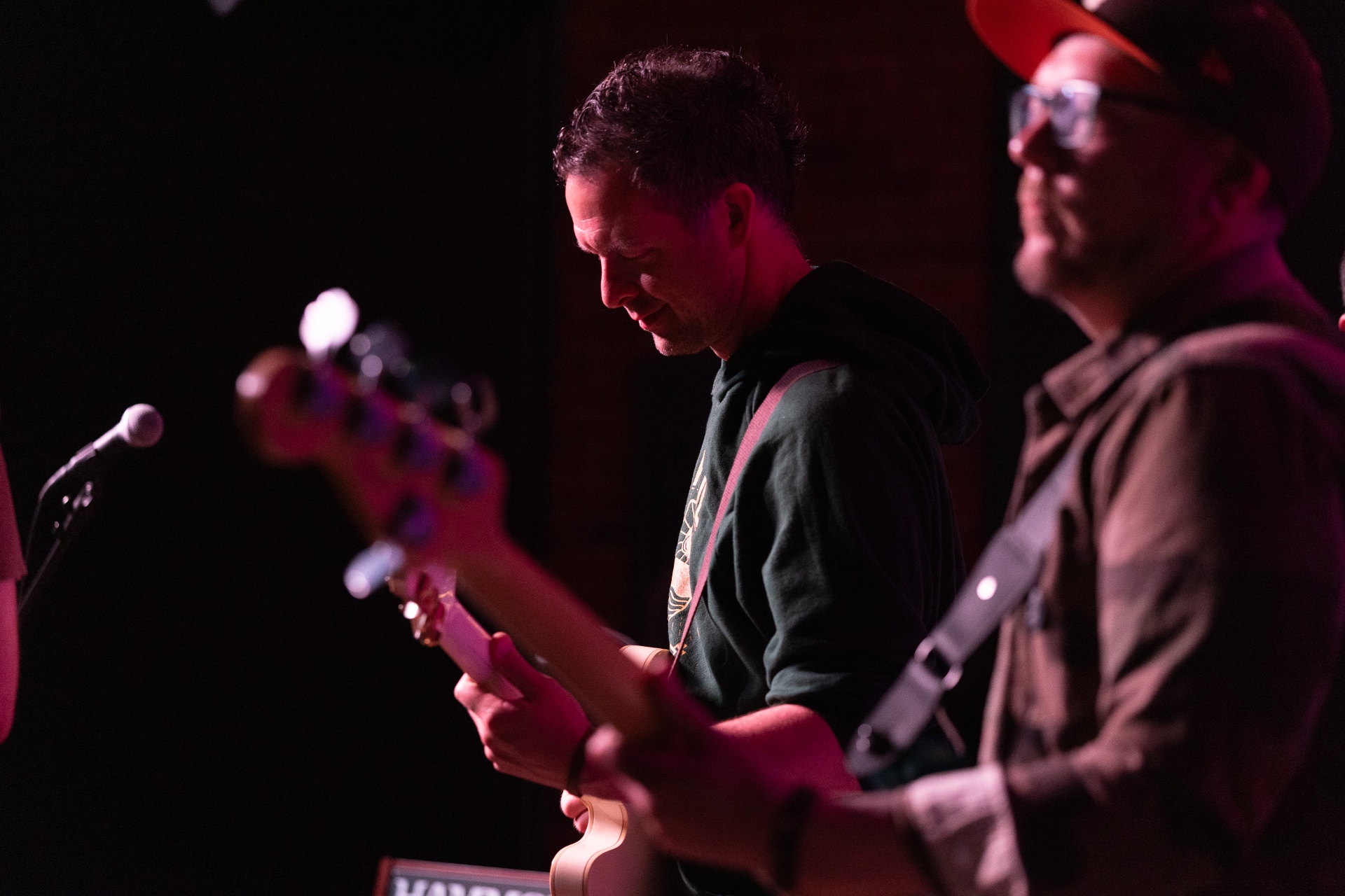 Bass and guitar on stage