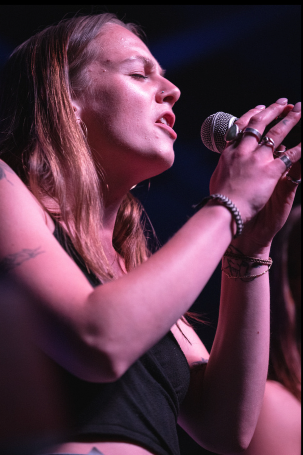 Singer with eyes closed